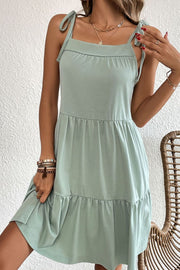 Light green tie-strap mini dress with square neckline and ruffle hem