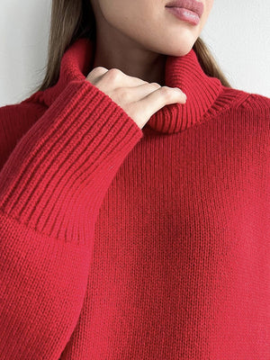 Deep Red acrylic turtleneck sweater with ribbed cuffs and sculptural sleeves.