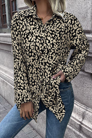 Women's black and beige abstract spot print oversized button-up shirt with collar.