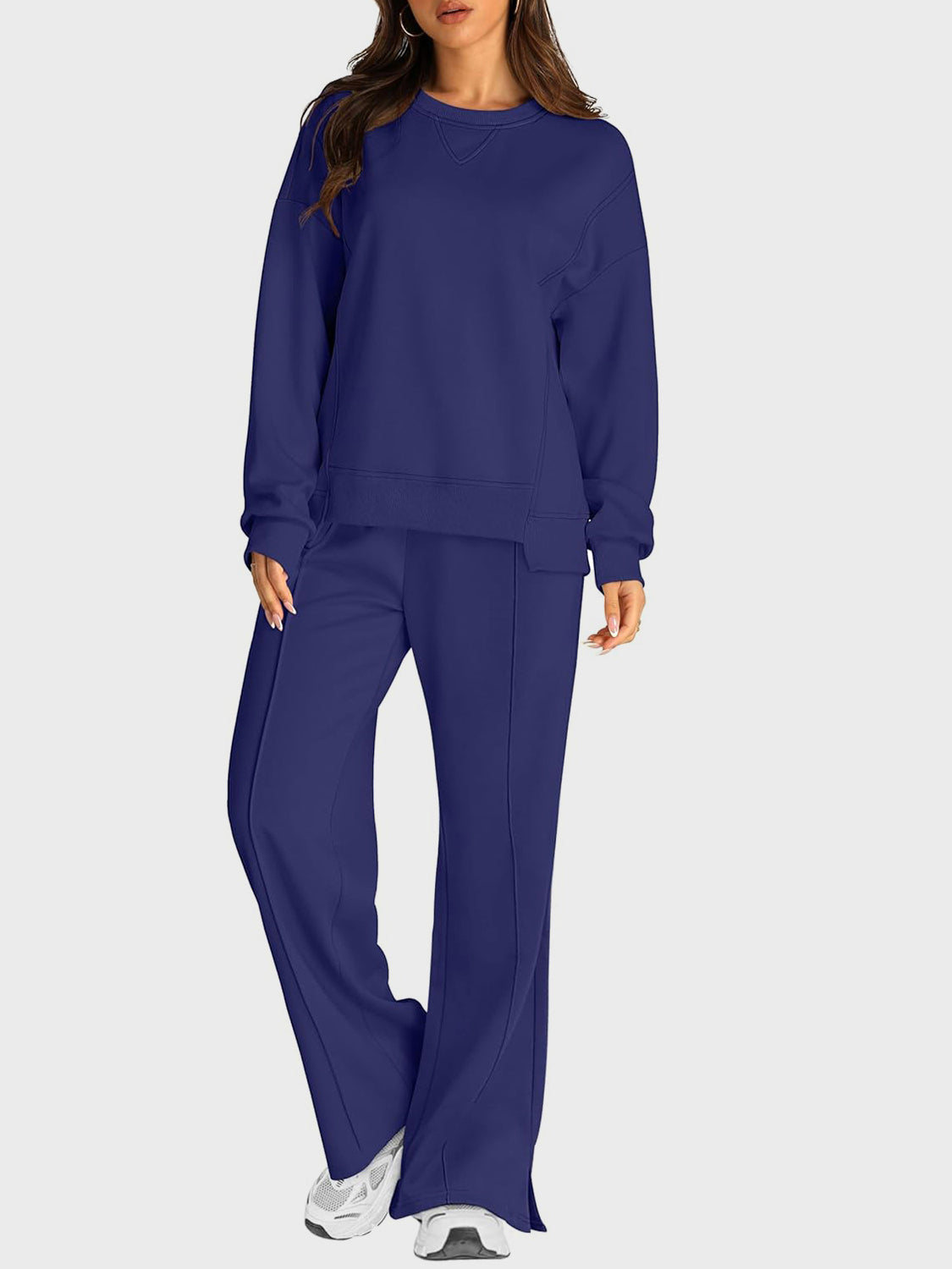 Dark blue loungewear set with crewneck sweatshirt and slit-front trousers.