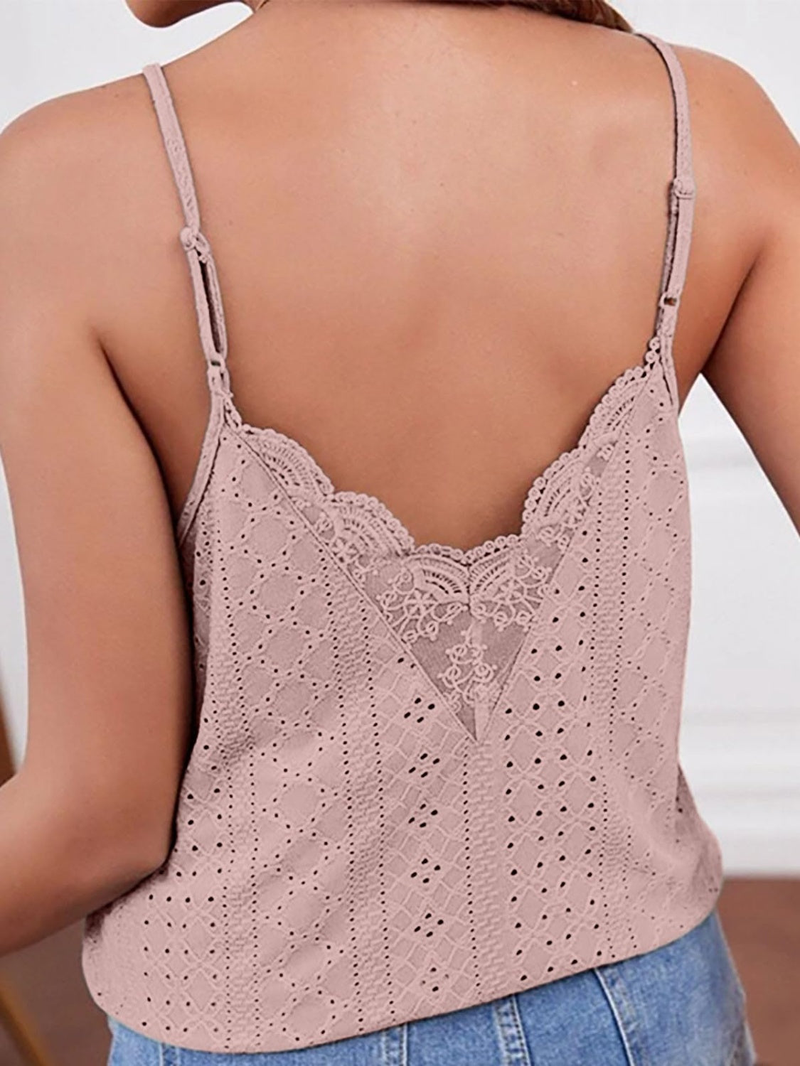Dusty pink eyelet lace inset cami top with V-neck and adjustable straps.