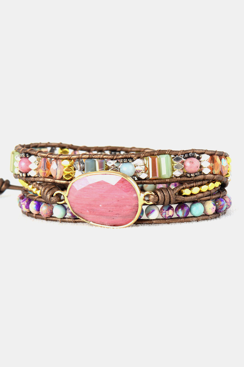 Bohemian wrap bracelet with pink stone and colorful beads on leather cords
