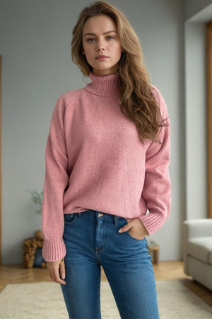 Blush pink speckled Donegal turtleneck sweater with ribbed cuffs and collar.