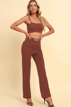 Caramel chain strap crop top and high-waist trousers with chain belt detail