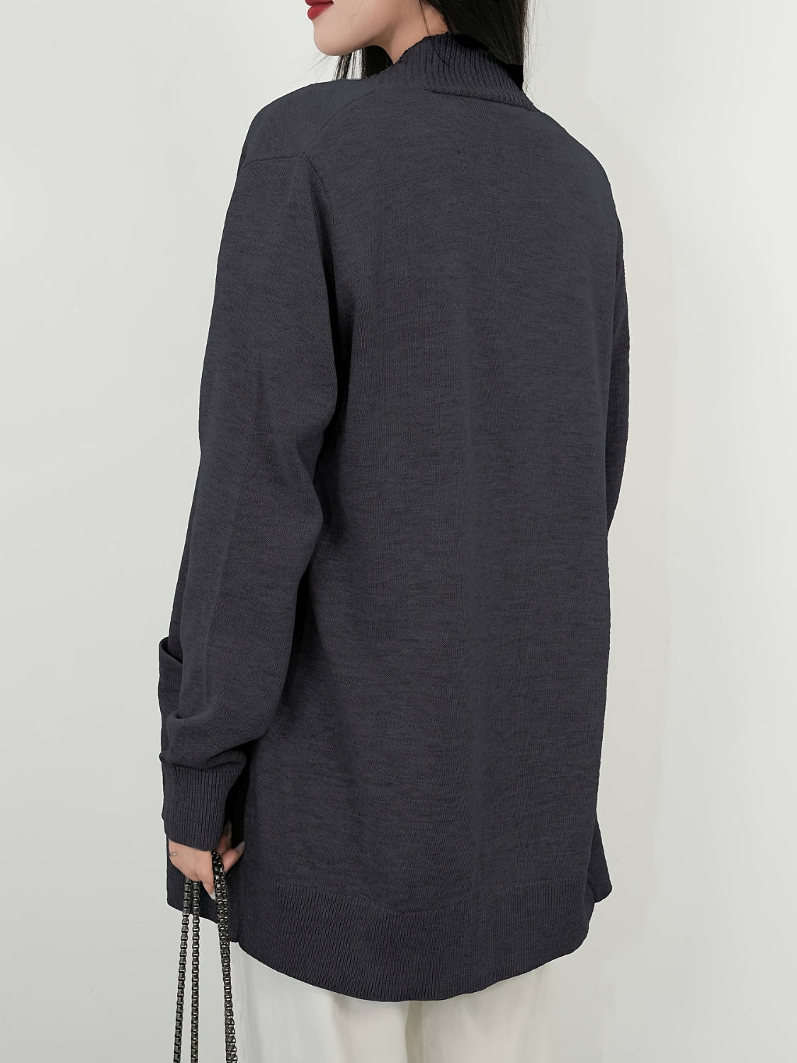 Dark gray textured knit open-front cardigan with pockets and ribbed cuffs.