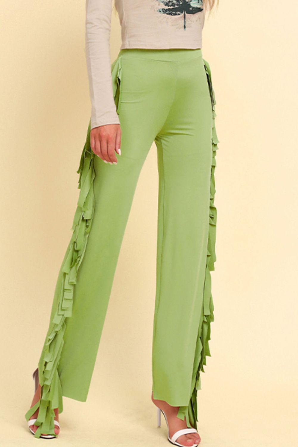 Yellow-green palazzo trousers with cascading fringe detail on the sides.
