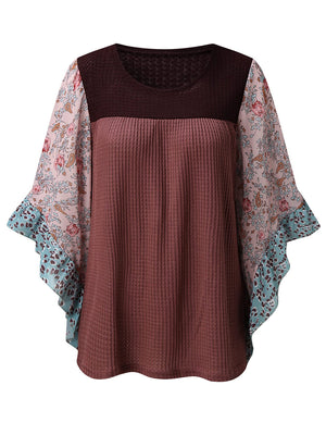 Textured panel blouse with flutter sleeves in mauve and floral print.