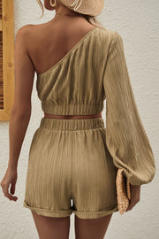 Khaki textured one-shoulder crop top with balloon sleeve and matching cuffed shorts.