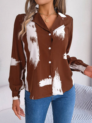 Brown brushstroke print collared blouse with white abstract art pattern.