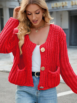 Chunky knit red cardigan with gold buttons and pockets.