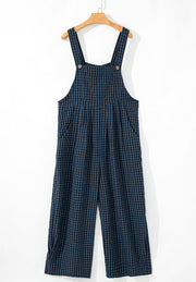 Textured dark blue gingham wide-leg overalls with button detail and pockets.