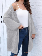 Light gray cable knit cocoon cardigan with open front and long sleeves.