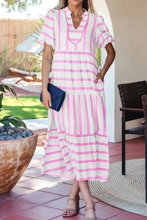 Tiered maxi dress with pink stripes, notched neckline, and short sleeves.