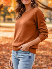 Black pullover sweater with ribbed cuffs and long sleeve