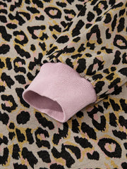 Cozy leopard print loungewear set with pink ribbed cuffs and neckline detail.