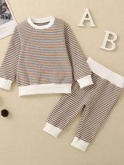 Baby knit set with brown and white stripes, long sleeves, crewneck, and matching pants.