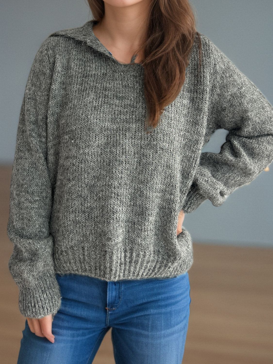Textured knit polo sweater in dark gray acrylic with a relaxed fit and ribbed hem.