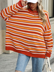 Orange striped oversized knit sweater with crew neck and long sleeves.