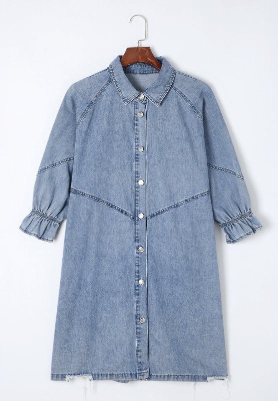 Light blue denim shirtdress with button front, ruffled cuffs, and A-line cut.