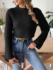 Black ribbed knit crop sweater with bell sleeves and mock neck.