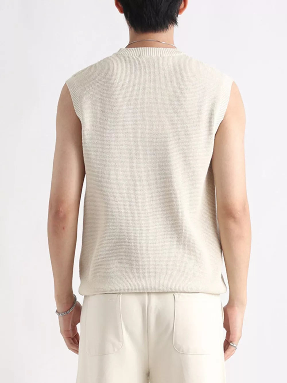 Men's textured knit tank top in apricot with a crew neck.