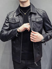 Men's black faux leather trucker jacket with chest pockets and zip closure.