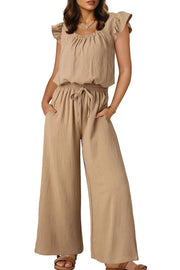 Tan textured drawstring palazzo jumpsuit with ruffle sleeves and wide legs.