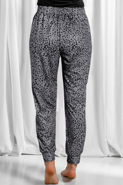 Jogger trousers in dark gray with a black leopard print and elastic waistband.