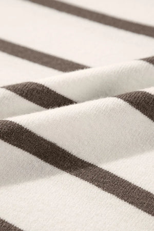 Striped knit blouse with cap sleeves and slit hem detail.