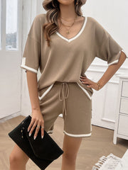 Mocha knit lounge set with contrast trim, V-neck top and drawstring shorts.