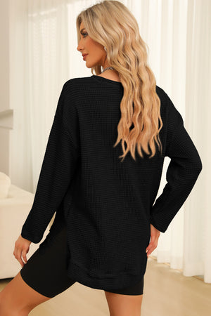 Black waffle knit oversized top with slit hem detail