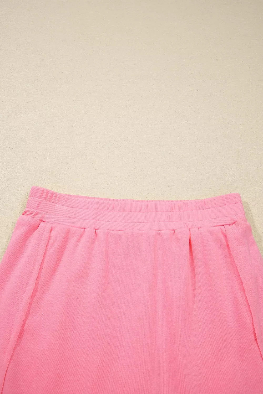 Dusty pink pocketed skort with elastic waistband and pleats