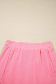 Dusty pink pocketed skort with elastic waistband and pleats