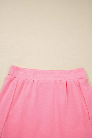 Dusty pink pocketed skort with elastic waistband and pleats