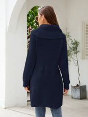 Dark blue waffle knit tunic with cowl neckline and long sleeves.