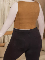 Caramel faux suede cropped vest with lace-up detail, worn over a white long-sleeve shirt.