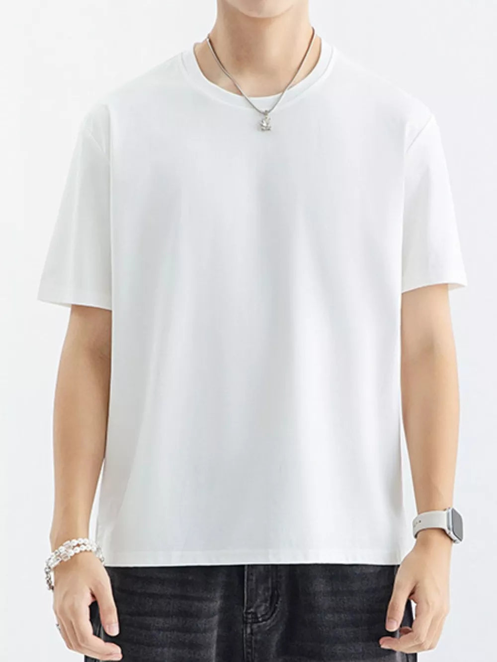 Men's white cotton crewneck t-shirt with short sleeves, a relaxed fit, and a simple design.