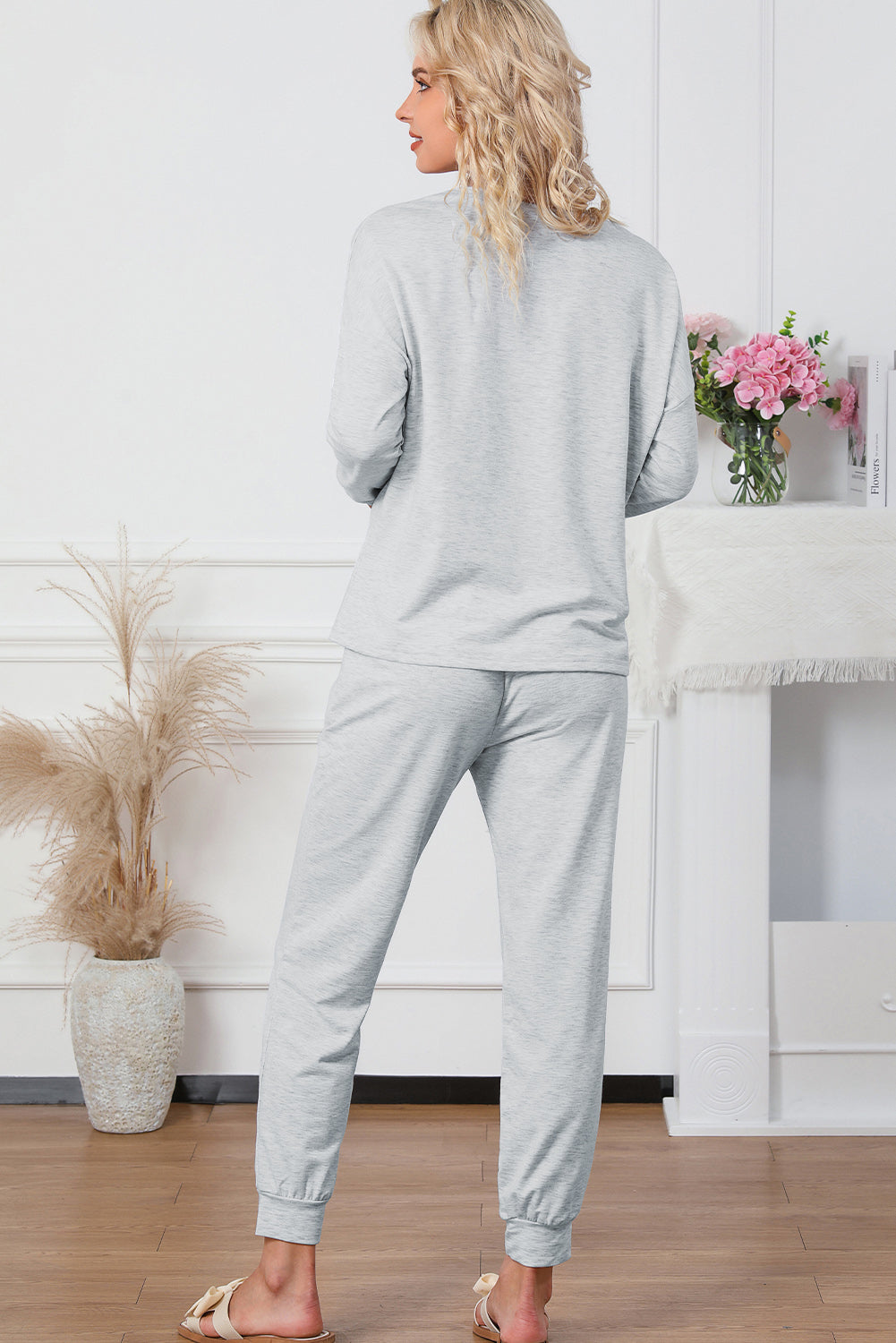 Plush lounge set in light gray, relaxed fit joggers with cuffed ankles.