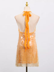 Orange iridescent sequin halter mini dress with tie back detail.
