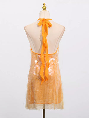 Orange iridescent sequin halter mini dress with tie back detail.