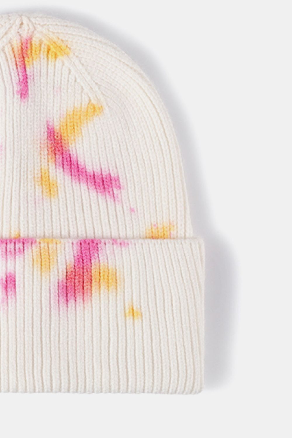 White ribbed knit beanie with pink and yellow dip-dye accents