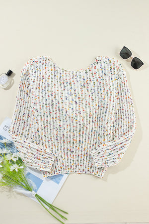 White confetti knit sweater with boatneck and open back detail.
