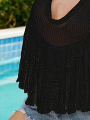 Black knit halter peplum top with a draped neckline and scalloped hem.