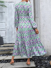 Vibrant paisley print maxi dress with balloon sleeves and tiered skirt.
