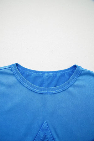 Blue mineral wash cotton tee with triangle patch detail and crew neck.