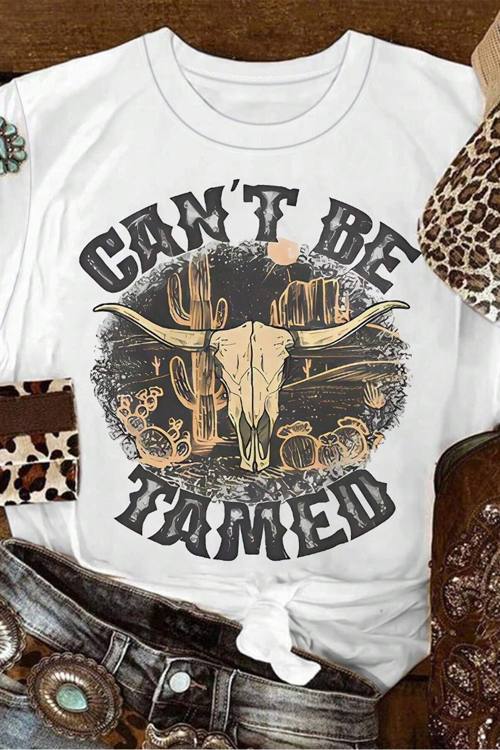 White cotton blend graphic tee with bull skull and cactus desert scene.
