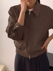 Brown zip-up jacket with collar, elasticated hem, and buttoned cuffs.
