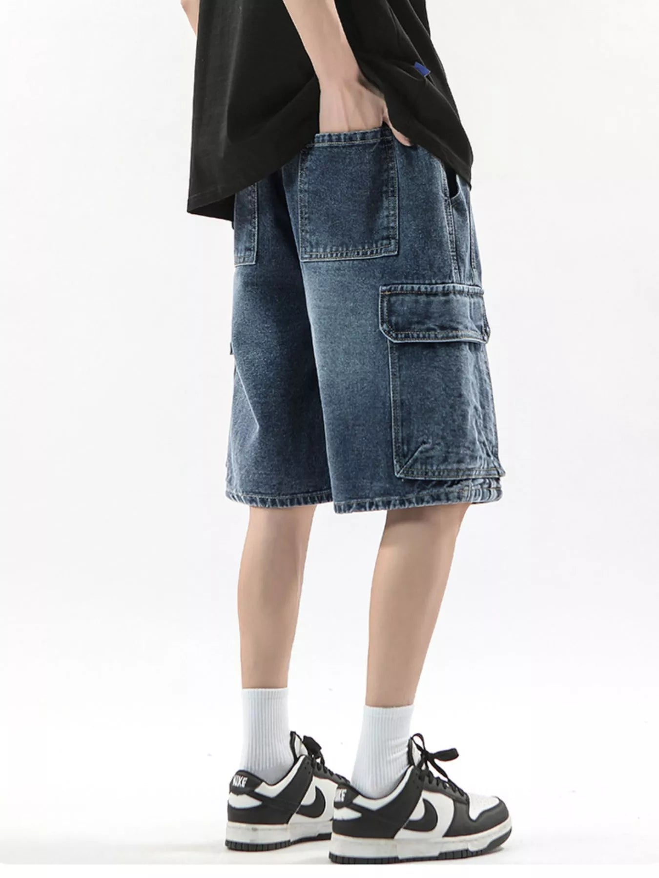 Men's denim cargo shorts in Vintage Blue with multiple pockets and drawstring waist.