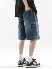 Men's denim cargo shorts in Vintage Blue with multiple pockets and drawstring waist.