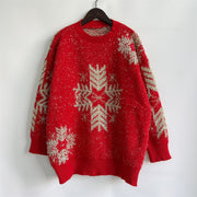 Red acrylic sweater with silver snowflake embellishments and metallic threads.